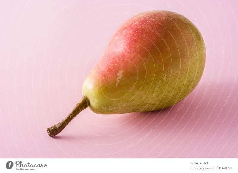 Healthy fresh pear on pink background Pear Fruit Food Healthy Eating Food photograph Tradition Snack Vitamin Green Natural ercolini isolated Vegan diet