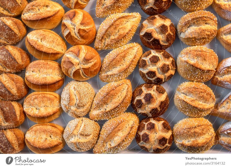 Bread buns diversity. Cute decorated bread rolls. Bavarian rolls Roll Nutrition Shopping Healthy Eating Fresh Small Yellow Tradition above view assortment