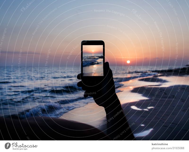 Man takes a sunset photo on the phone Vacation & Travel Summer Beach Ocean Cellphone PDA Technology Adults Hand Environment Nature Landscape Sky Dark Blue
