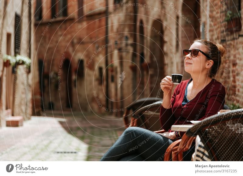 Young woman enjoying coffee in outdoor cafe To have a coffee Hot drink Coffee Espresso Mug Lifestyle Vacation & Travel Tourism Human being Feminine