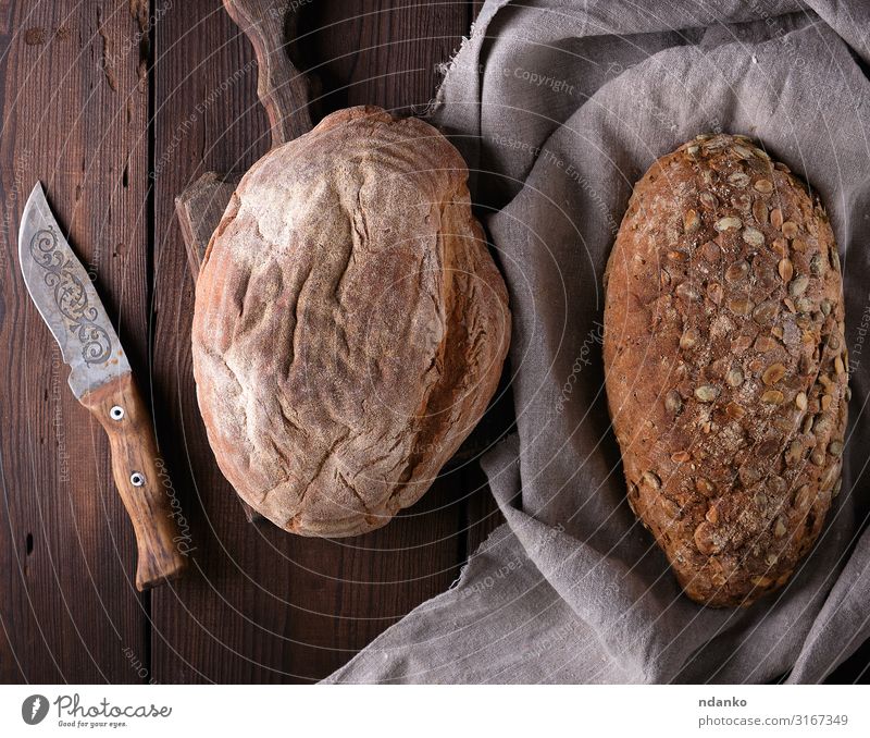 bread made from rye flour with pumpkin seeds Bread Nutrition Breakfast Diet Table Wood Fresh Natural Above Brown Gray Tradition knife Gourmet Flour Baking