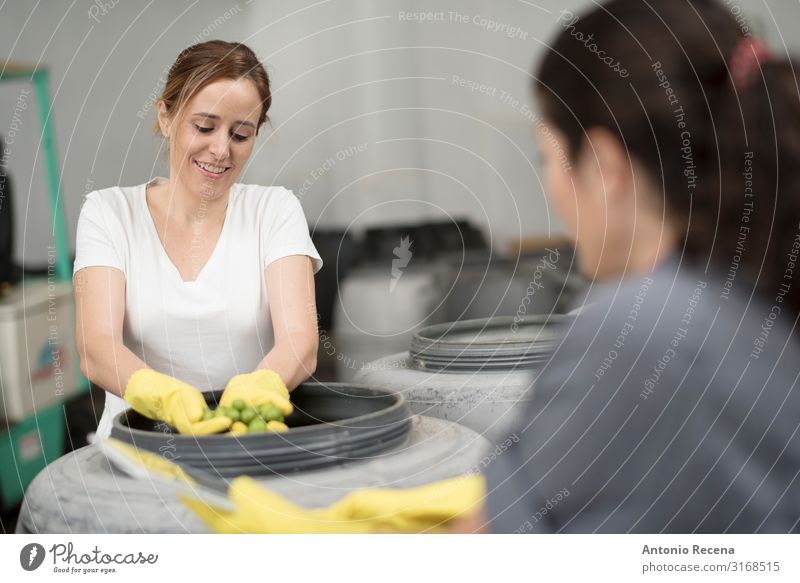Worker women controlling olives fermentation Fruit Work and employment Profession Workplace Factory Industry Business Technology Woman Adults Partner 2