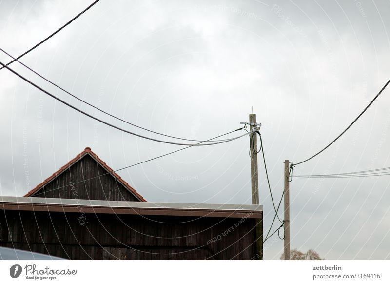 Village with cables Mountain House (Residential Structure) Barn Gable Roof Pole Electricity pylon Telegraph pole Telephone line Transmission lines left