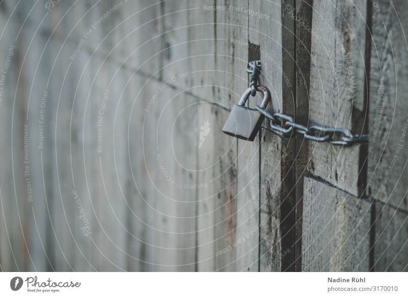 finalized Hut Door Wood Metal Brown Gray Lock Closed locked Door lock Garden door No admittance Subdued colour Exterior shot Detail Deserted Copy Space left Day