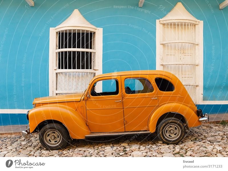 old orange car parked in front of blue house , trinidad - cuba Lifestyle Vacation & Travel Tourism Trip Island House (Residential Structure) Decoration Art
