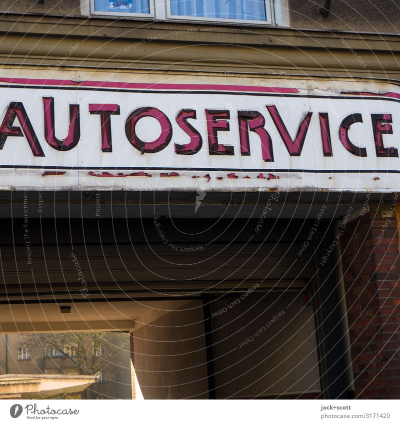 car repair Auto repair shop Facade Highway ramp (entrance) Courtyard entrance Characters Word Capital letter Typography Authentic Dirty Original Retro Mobility