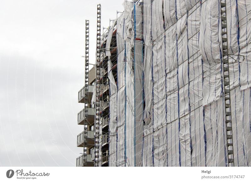 Facade of a building on a construction site covered with plastic tarpaulins Hamburg Town Port City Manmade structures Building Metal Plastic To hold on Stand