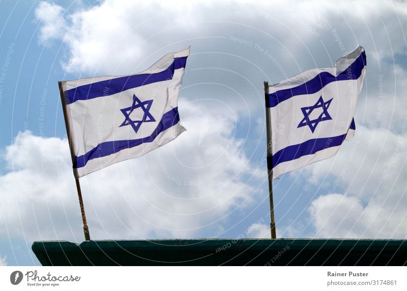 Two Israeli national flags in the wind Sky Clouds Wind Tel Aviv Ensign Flagpole Blue White Blow Colour photo Exterior shot Copy Space bottom Copy Space middle