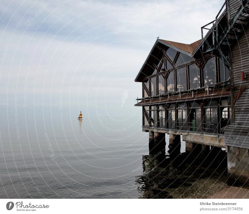 Old wooden house on stilts in Cedar Key, Florida Wooden house Restaurant stilt house Glass front Window Vantage point outlook sea view Harbour Old town Historic