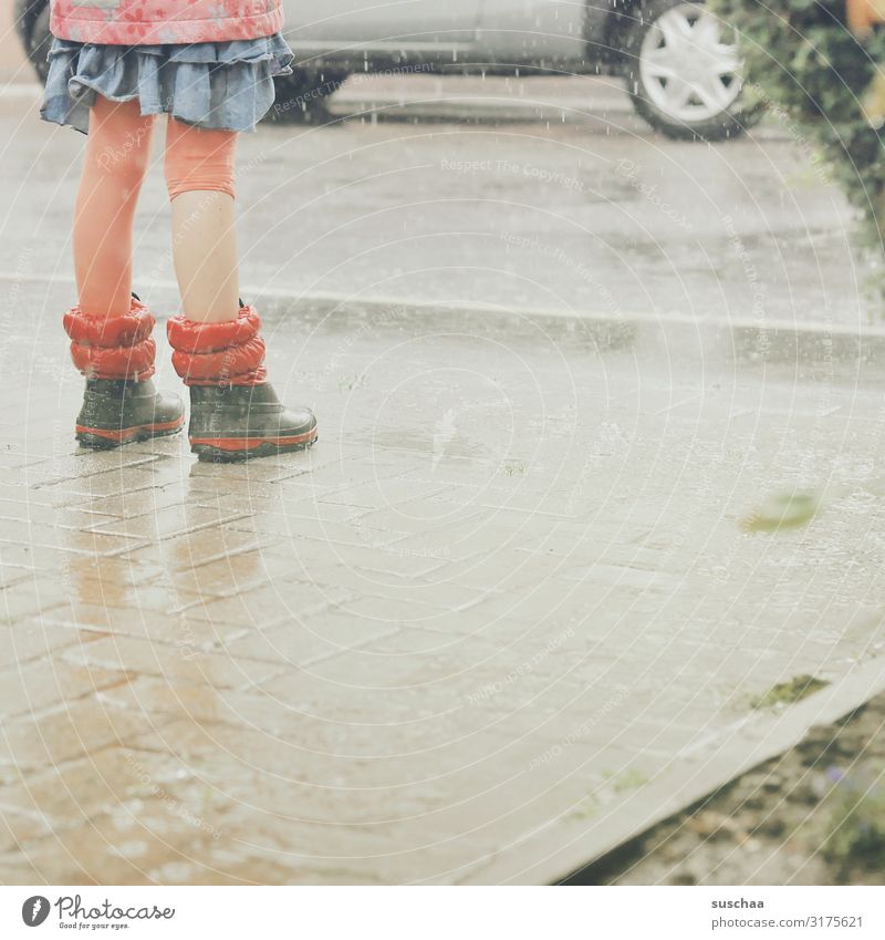 in the rain .. Child Girl Rain Rainwater Wet Water Legs Rubber boots Car Street Asphalt Joy Summer Courtyard entrance Weather