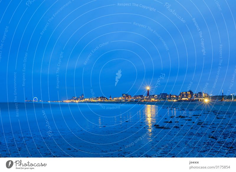 Scheveningen beach in the evening with a view of the lighthouse and Ferris wheel Wide angle Deep depth of field Artificial light Twilight Evening Exterior shot