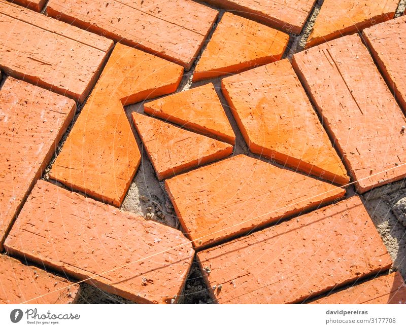 Orange brick paving stones in construction process Work and employment Profession Tool Sand Building Architecture Terrace Lanes & trails Stone Concrete Red Pave
