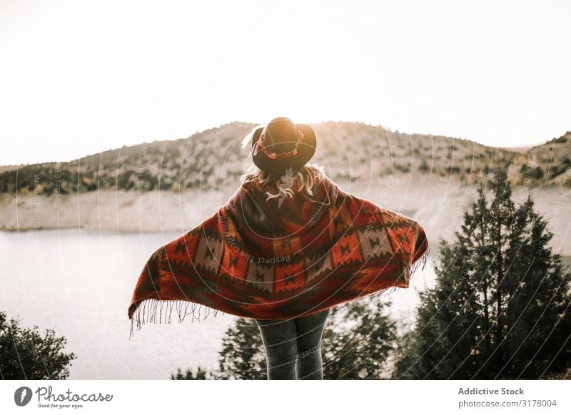Anonymous woman near calm lake on sunrise Woman Lake Sunrise Sky Mountain Vacation & Travel admiring Morning Freedom Landscape poncho Hat Recklessness Dawn Dune