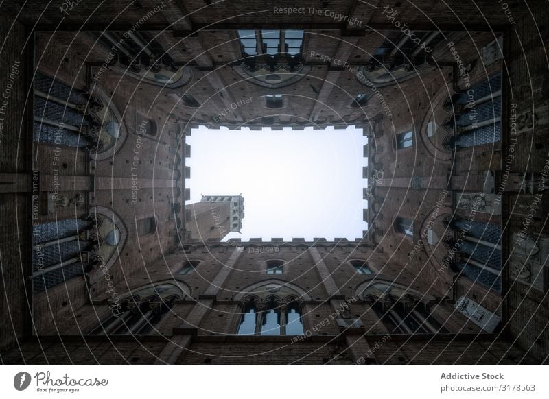 Perspective view from courtyard on stone tower Courtyard Masonry Architecture Old Building Tuscany Italy medieval Stone Ancient Historic Castle