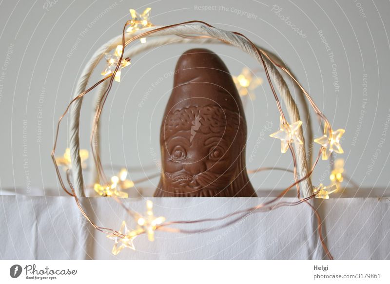 Chocolate Santa Claus looks out of a white paper bag with starlight Feasts & Celebrations Christmas & Advent Bag Paper Carry handle Star (Symbol) Sign