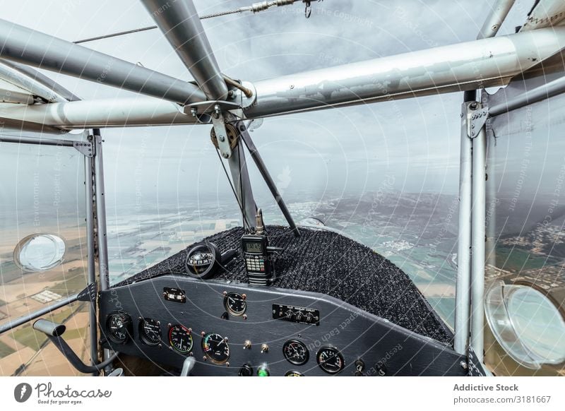 Aerial view from inside the cockpit of a small plane Vantage point Cockpit Pilot Small Airplane Aircraft Interior design Story Transport Light Interior shot