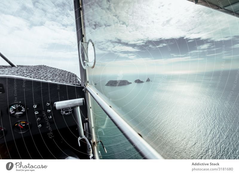 Flight over islands in the middle of the sea Airplane Aircraft Vantage point Window Summer Island Ocean Nature Blue Sky Vacation & Travel Landscape Horizon Fly