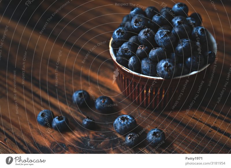 Blueberries in a bowl on a wooden base Food Fruit Blueberry Nutrition Organic produce Vegetarian diet Diet Bowl Fresh Delicious Round Juicy Sweet Brown To enjoy