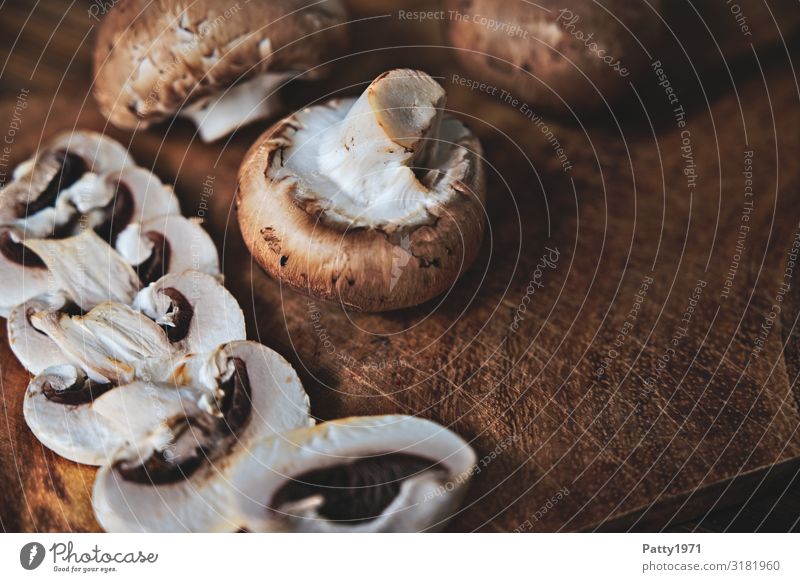 Mushrooms on a wooden table Food Button mushroom Nutrition Organic produce Vegetarian diet Chopping board Fresh Delicious Brown White To enjoy Food photograph