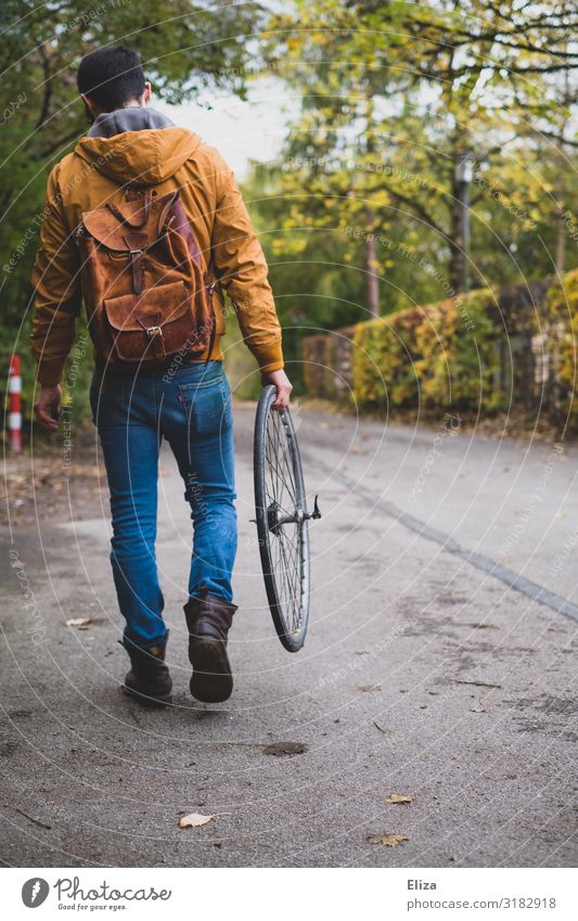 Bicycle broken Masculine Young man Youth (Young adults) Man Adults 18 - 30 years 30 - 45 years Going Lanes & trails Bicycle tyre Repair Flat tire Part mend Tire