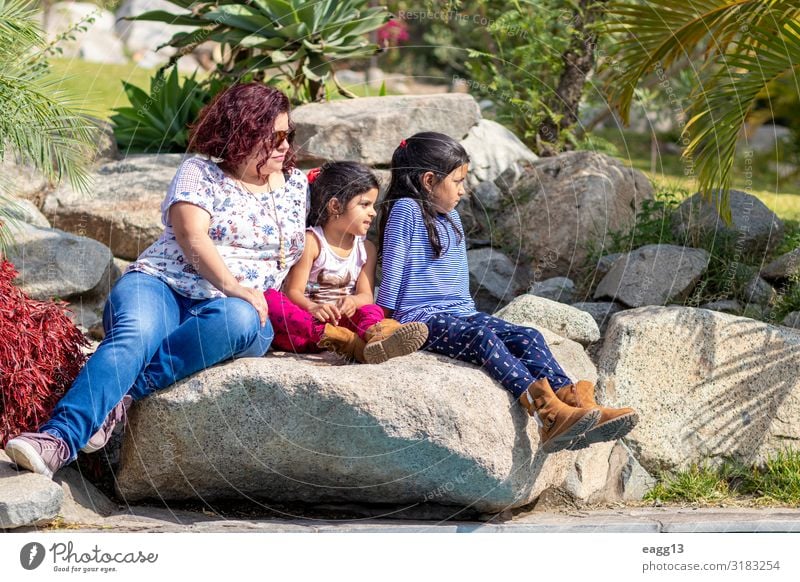 Cute family of mother and daughters in the garden Lifestyle Joy Happy Beautiful Face Garden Feasts & Celebrations Parenting Child Human being Feminine Toddler