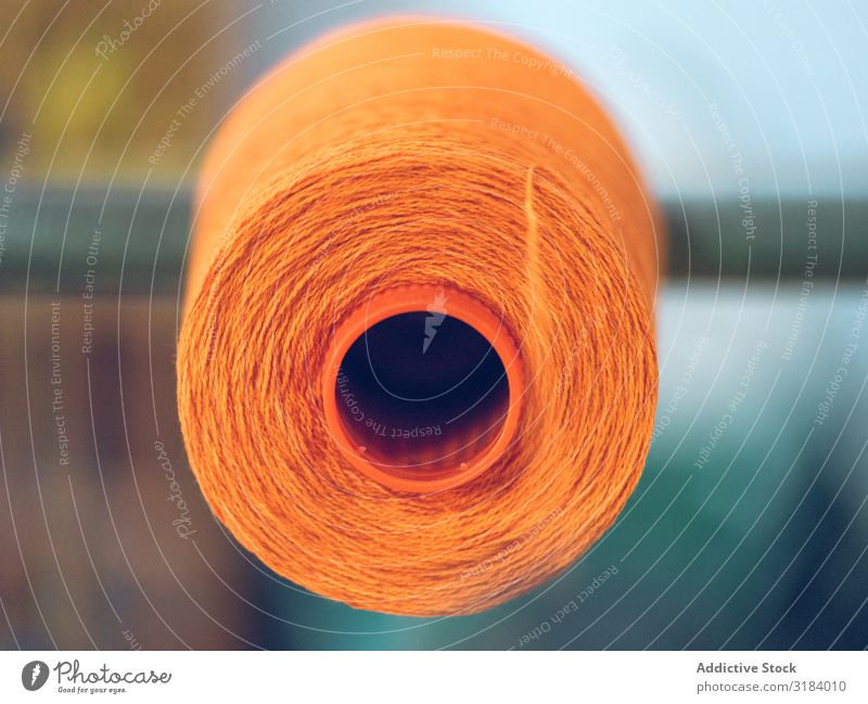 Spools of thread on weaver loom Thread spools Loom Industry Factory Fiber Cotton textile Cloth machine Production String Craft (trade) yarn Orange Bright Colour