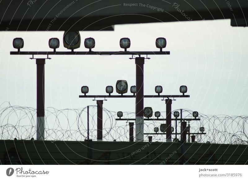 hint of light Aviation Sky Traffic infrastructure Landing strip lights Lamp Retro Under Many Moody Safety Symmetry Target Barbed wire Light blue Subdued colour