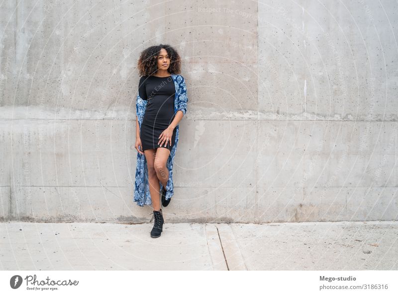 Afro-american woman against grey wall. Style Happy Beautiful Face Human being Woman Adults Fashion Clothing Brunette Smiling Stand Cool (slang) Friendliness