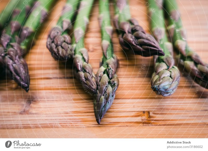 A bunch of green asparagus on wooden surface Asparagus Vegetable Surface Wood Ingredients Green Fresh Diet Food Organic Healthy Vegetarian diet Nutrition