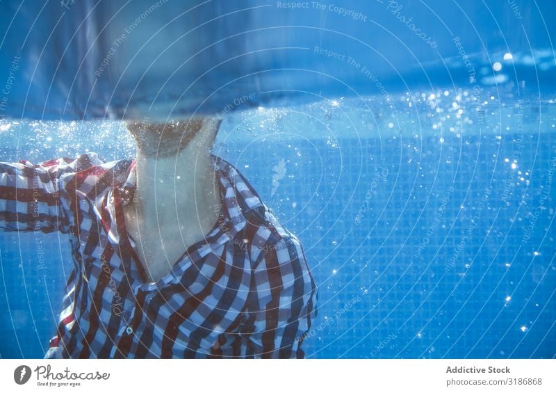 Dressed man in swimming pool Underwater photo Air bubble Man Accident Clothing Swimming pool Wet Vacation & Travel Youth (Young adults) Resort