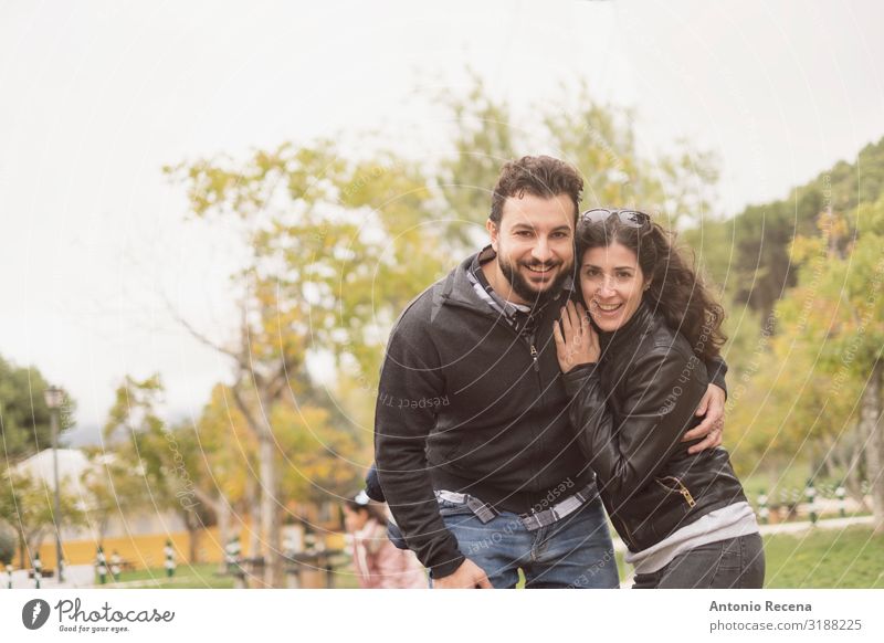 30-40 years old Couple in park posing for a photo Lifestyle Happy Valentine's Day Human being Woman Adults Man Park Brunette Beard Smiling Laughter Love