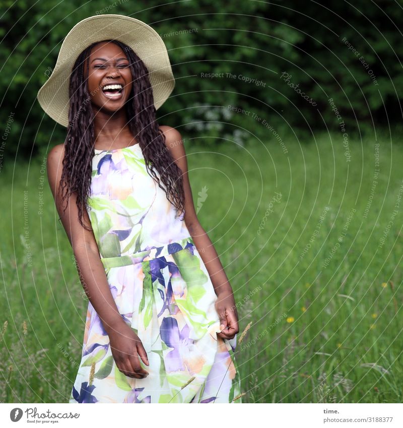 laughing woman with straw hat in a meadow Feminine Woman Adults 1 Human being Park Meadow Dress Hat Brunette Long-haired Laughter Stand Free Happiness pretty