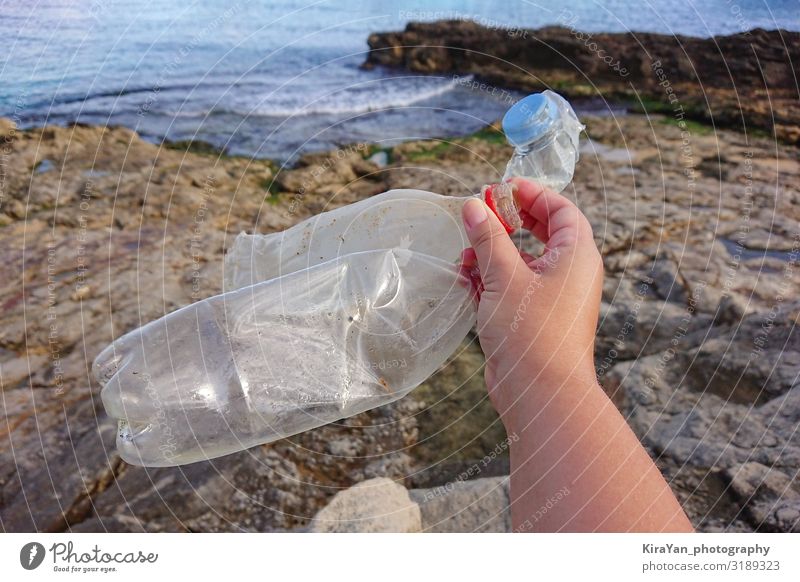 Old plastic bottle in hand Beverage Bottle Lifestyle Summer Beach Human being Hand 1 Environment Nature Landscape Climate change Packaging Tube