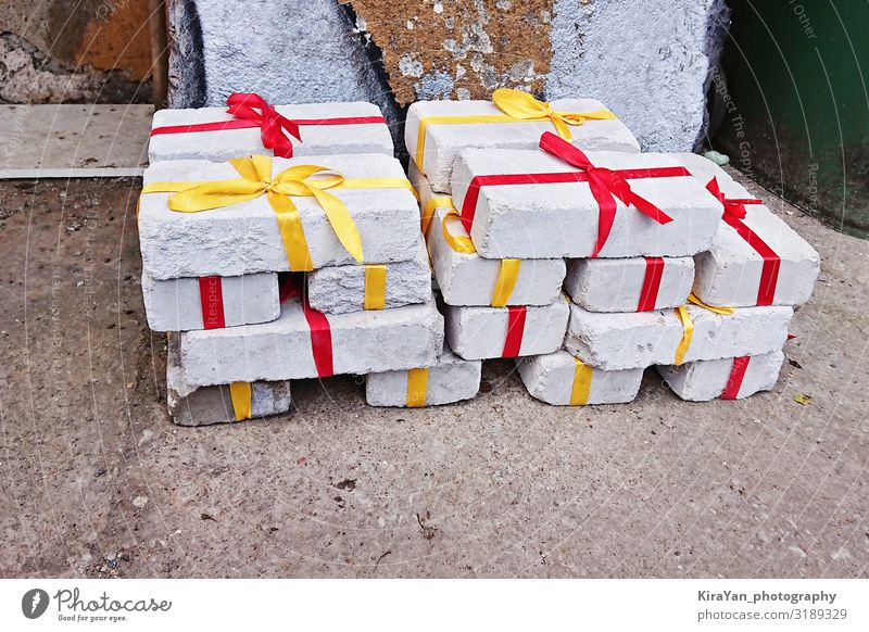 White bricks with red ribbon as gift Lifestyle Shopping Design Decoration Christmas & Advent Birthday Packaging Box Brick Curiosity Yellow Red Surprise