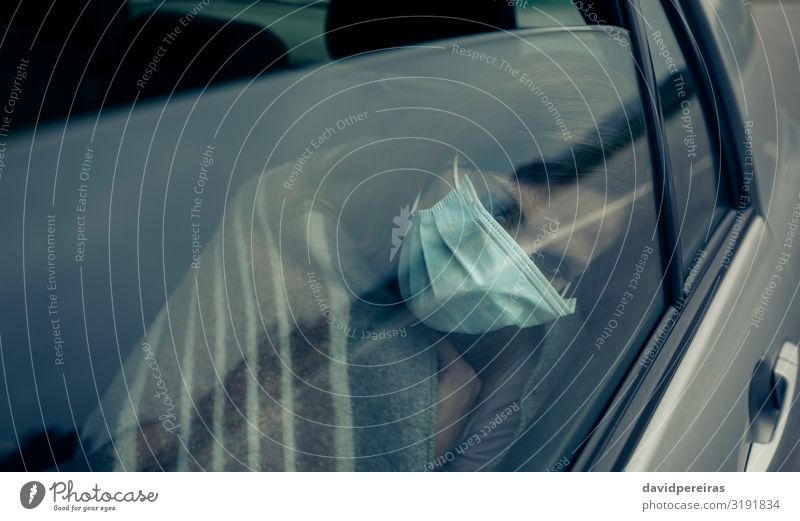 View through the car window of a woman with mask Illness Medication Human being Woman Adults Car Sit Protection Fatigue Epidemic Virus putting on inside a car