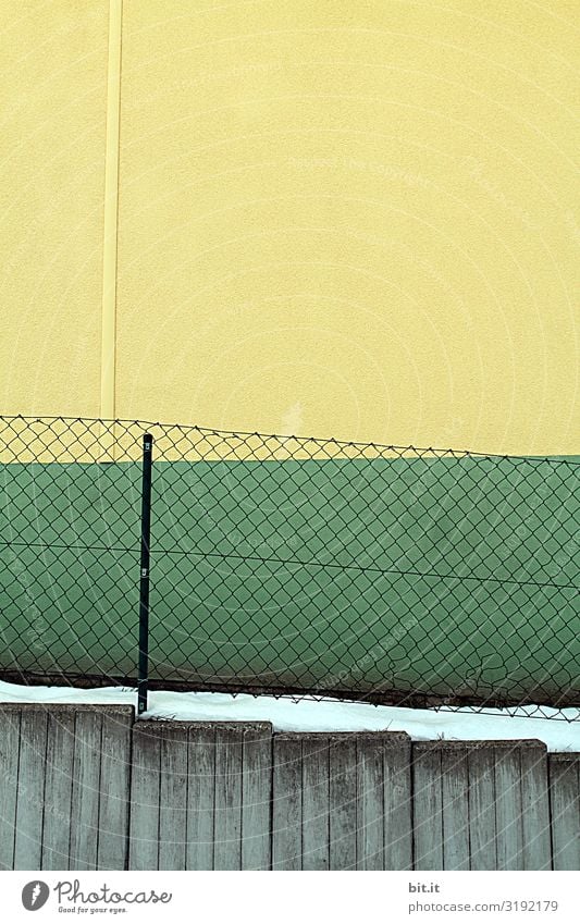 Fence and facade in green - yellow Art Environment Snow Architecture Wall (barrier) Wall (building) Facade Line Stripe Net Sharp-edged Clean Trashy Gloomy