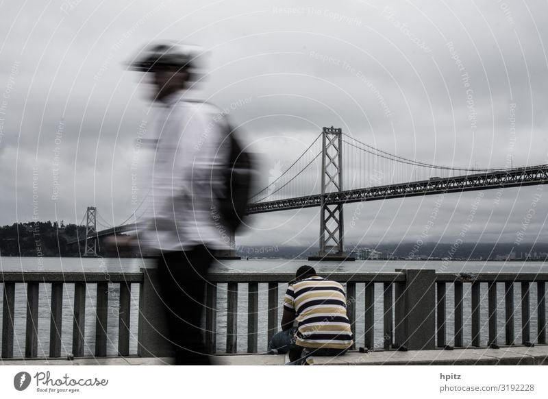 rush hour Body 2 Human being Environment Bad weather San Francisco Bridge Transport Movement Sit Gloomy Town Gray Moody Hope Sadness Grief Homesickness