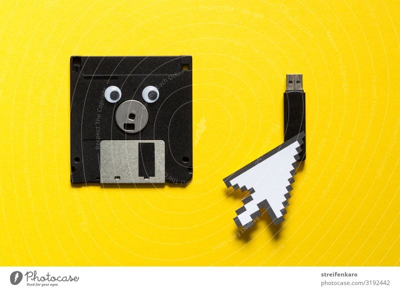 A discarded floppy disk looks wistfully at the USB stick, which the mouse pointer prefers Office work Media industry Computer Notebook Computer mouse Software