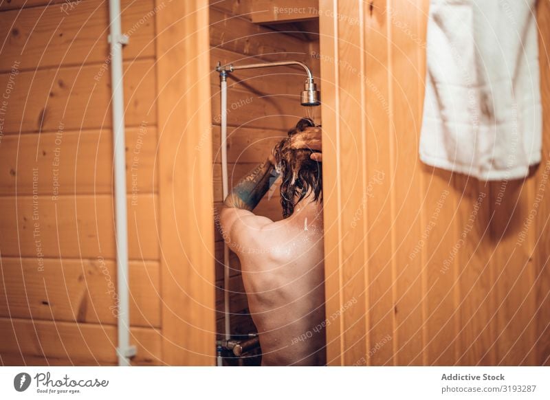 Man taking shower in wooden bathroom Take Take a shower Bathroom Water Wet Clean Considerate Healthy Hipster Human being handsome Morning Fresh bearded Washing