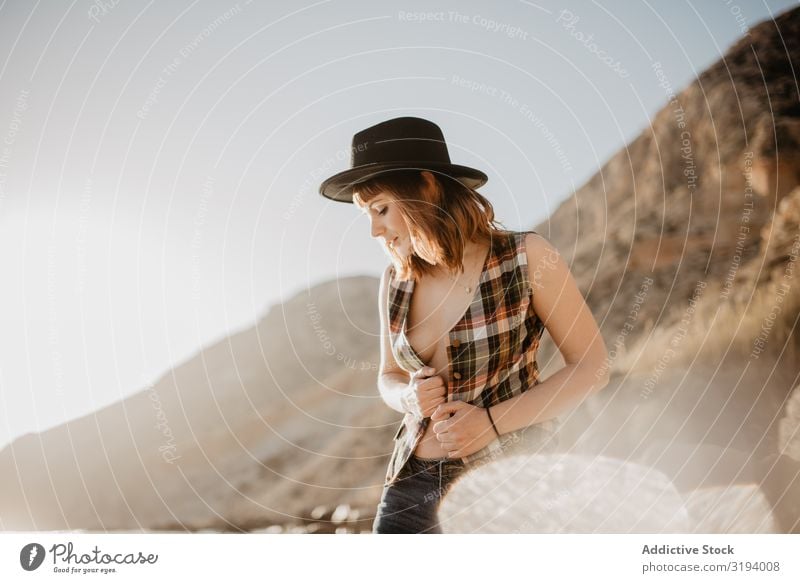 Sensual woman posing on seashore Woman Posture Coast To enjoy Mountain Ocean Sunbeam Day unbuttoned Shirt Breasts Harmonious Idyll Lifestyle Leisure and hobbies