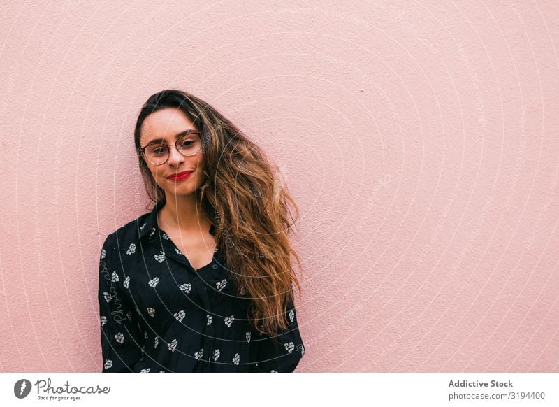 Smiling young woman against pink wall Woman Youth (Young adults) Happy Easygoing Portrait photograph Cheerful Person wearing glasses Emotions Expression