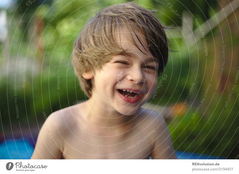 Child lying on a meadow - a Royalty Free Stock Photo from Photocase