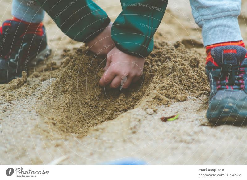 Boy digging in the sandbox Joy Happy Contentment Playing Garden Parenting Kindergarten Child Sandpit Playground Muding Human being Boy (child) Infancy Hand