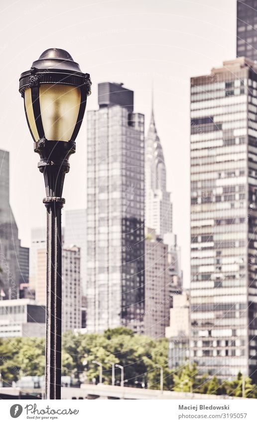 Street lamp with New York blurred skyline in background. Vacation & Travel Sightseeing City trip Sky Small Town Skyline High-rise Building Architecture Retro