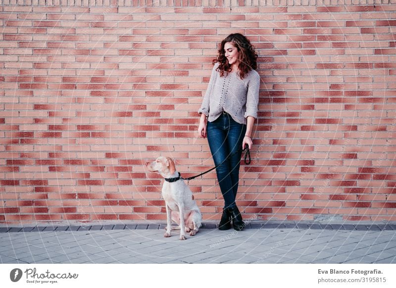 young woman and her dog at the city. standing by a brick wall Portrait photograph Woman Dog Park Youth (Young adults) Exterior shot Love Pet owner Beautiful