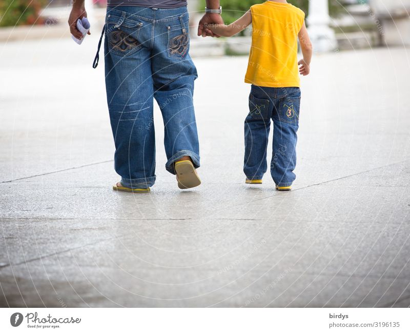 Father and son Lifestyle Masculine Child Boy (child) Adults Infancy 2 Human being 3 - 8 years 18 - 30 years Youth (Young adults) 30 - 45 years Summer Town Jeans