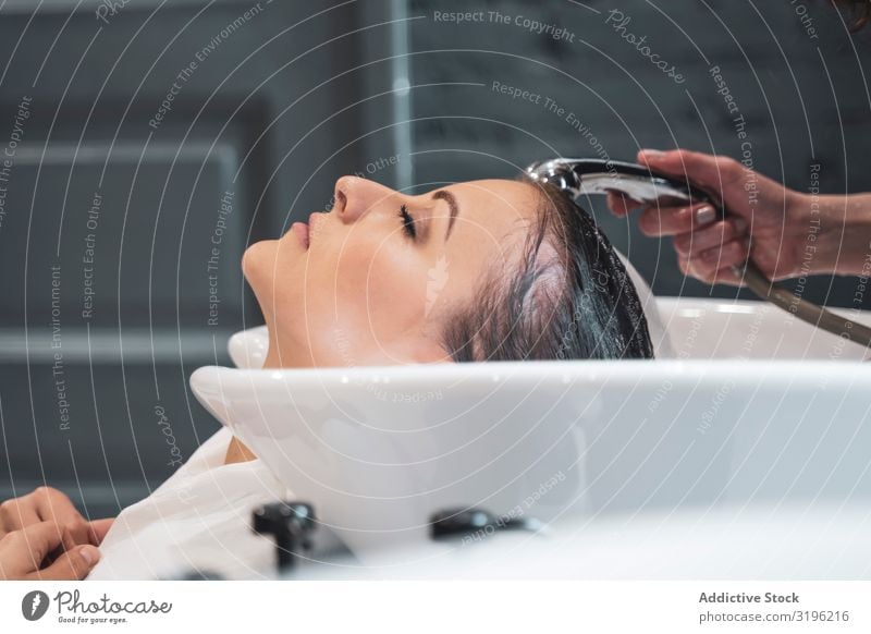 Stylist washing hairs to young lady Washing Hair Lady Youth (Young adults) Attractive Sink Considerate Wet Clean Beauty Photography Fashion Woman Style
