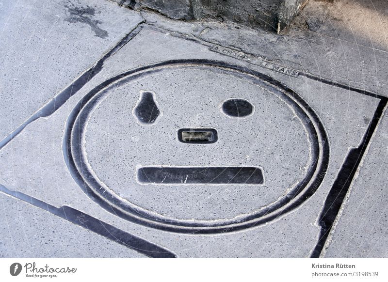 manhole cover face Face Street Sign Observe Sadness Concern Fatigue Reluctance Longing Disappointment Loneliness pareidolia Gully Facial expression anxious