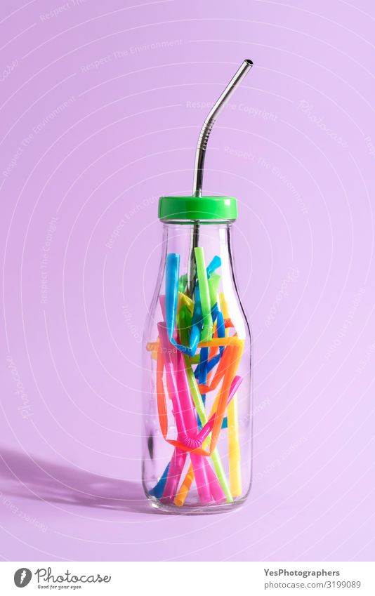 Metal straw in bottle with plastic pieces. Plastic waste concept Drinking Bottle Straw Lifestyle Environment Sustainability Green Environmental pollution