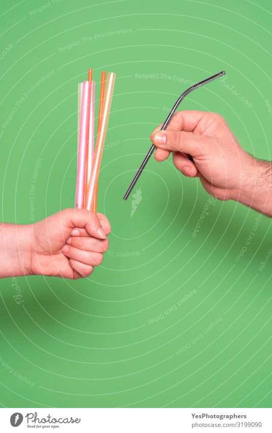 Replacing plastic drinking straws with metal straw concept. Woman